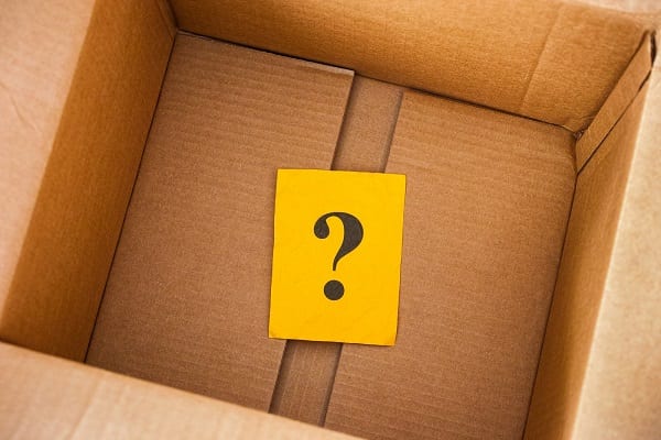 a question mark on a post it note inside a cardboard box - a blog post on where to buy cardboard boxes.